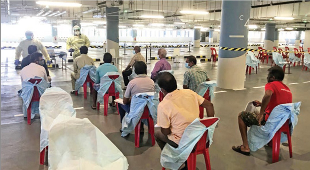  ​Screening of patients in the carpark of one of the Swab Isolation Facilities allowed migrant workers a reprieve from the isolation of their hotel rooms. 