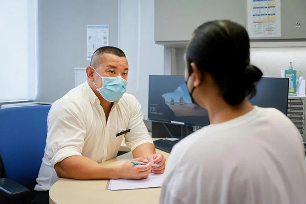  ​Daniel (right) and Dr Melvin Tay, a senior consultant at the department of respiratory and critical care medicine at SGH, on June 21, 2023. ST PHOTO GAVIN FOO