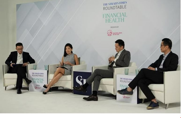  ​(From left) Moderator Tan Ooi Boon with panellists Melita Teo from AIA Singapore, SGH's Tan Hiang Khoon and biotech professional Herbert Ho at the ST Roundtable on Financial Health. ST PHOTO NG SOR LUAN