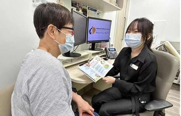  ​Yishun Polyclinic Care Coach Goh Zi Hui (right) with a patient. Care Coaches are non-clinical staff who create an individualised intervention plan for complex patients. PHOTO NATIONAL HEALTHCARE GROUP POLYCLINICS 