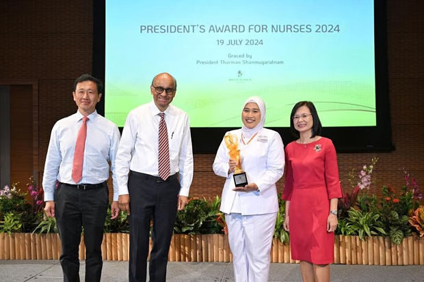  ​Ms Elena Mohamed Ayob (second from right) receiving the President’s Award for Nurses from President Tharman Shanmugaratnam at The Star Gallery on July 19. ST PHOTO SHINTARO TAY 
