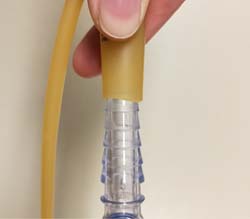 change urine bag - insert new drainage tubing